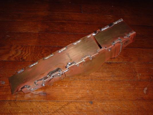 Bottom (sole) of the brass infill plane.