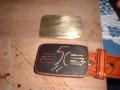The etched buckle after being darkened (antiqued).